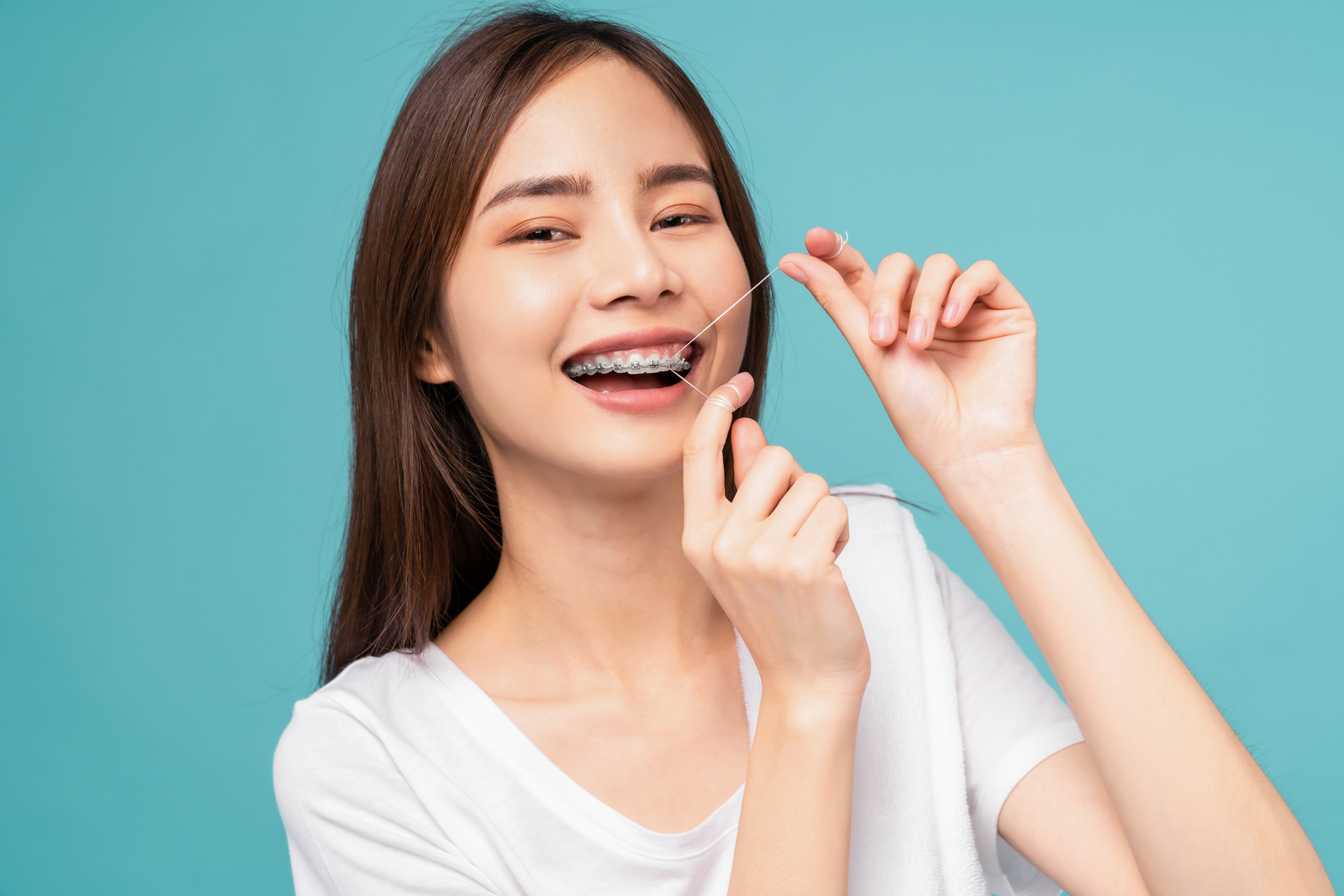 woman cleaning braces